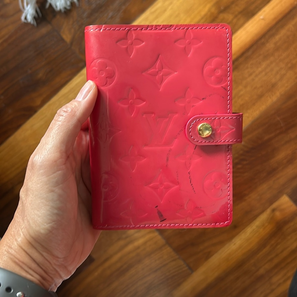 Patent leather monogram Louis Vuitton planner or wallet in pink.
